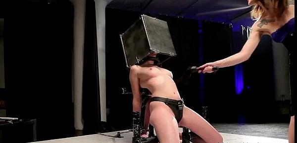  BDSM babe with head in steel box spaked